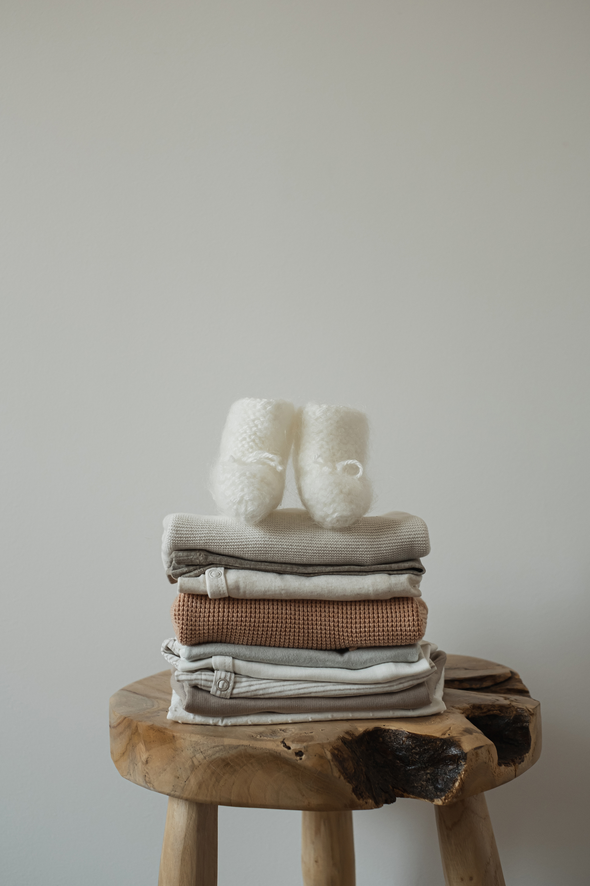 Baby Clothes on Wooden Stool